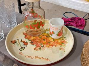 lot 486 image: Lot of (3) Strawberry Shortcake theme Dishwares - Serving Platter, Cup and Container