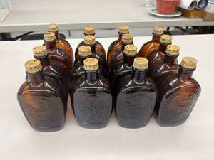 lot 110 image: 16 Vintage Maple Syrup Glass Bottles