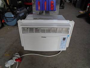 lot 116 image: Haier air conditioner with pull outs. Looks like 5 - 6000 btu Tested & works. No remote. As shown.