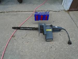 lot 121 image: Craftsman 110 volt chiansaw. Good used condition. As shown.