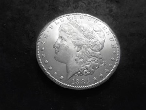 lot 28 image: 1884 CC Morgan Silver Dollar