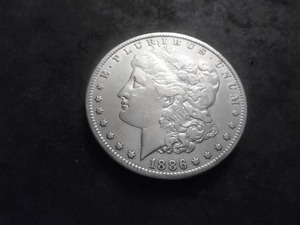 lot 34 image: 1886 O Morgan Silver Dollar