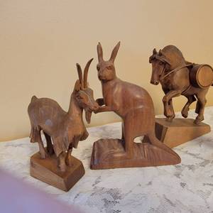 lot 143 image: Australian Carved Teak Animals  collection of 4