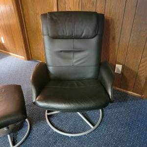 lot 9 image: Ikea Black Recliner Swivel  Chair & Ottoman