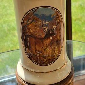 lot 31 image: Ceramic Jar Lamp with Buck Applique Art by J Brooks
