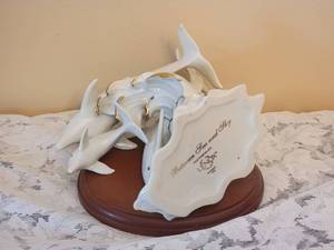 lot 99 image: Lenox Between Sea and Sky Porcelain Dolphin Figurine