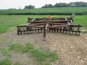 lot 2 image: Disc plow with weight. Measures 12...