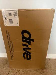 MSRP $350 NEW IN BOX Drive Medical 11125PSKD-1 Deluxe Steel Drop-Arm Height Adjustable Commode with Padded Seat - 300lb Weight Capacity