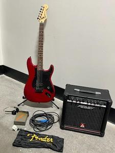 lot 1 image: Squier 20th Anniversary Bullet Stratocaster, Peavey Blazer 158 Transtube Guitar Amp (15 Watt), and Arion HW-02 Hot Watt-II Stereo Guitar Headphone Portable Amplifier