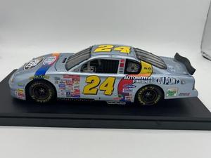 lot 10 image: NASCAR Jeff Gordon #24 Silver Du Pont 2000 Monte Carlo 118 Scale Diecast Stock Car
