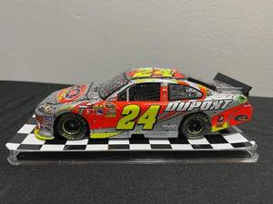 lot 12 image: NASCAR 2012 Jeff Gordon #24 124 Scale Lionel Du Pont 20 Years Chevy Impala Diecast Stock Car