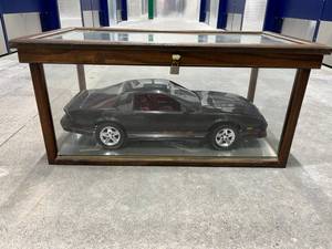 lot 92 image: Spectacular Vintage 23 Black Camaro Iroc Z28 Plastic Model Car with Glass Display Case