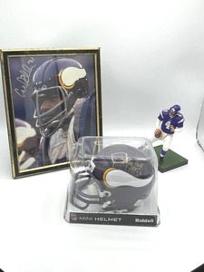 lot 95 image: Minnesota Vikings Bobby Bryant #20 Autographed Mini Helmet  Carl Eller #81 Autographed Photo  2009 McFarlane Brett Favre - No COA