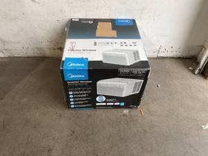 lot 29 image: Midea 12,000 BTU White U-Shaped Smart Inverter Window Air Conditioner with Remote Control