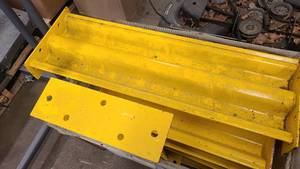 Large heavy yellow steel pieces for industrial use