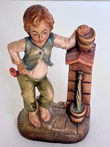 lot 27 image: Vintage Hand Carved Wooden Figurine Boy at a Well