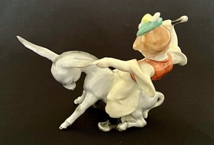 lot 32 image: Vintage Herend Hand Painted Figurine Boy Riding a Donkey Traditional Hungarian Folklore