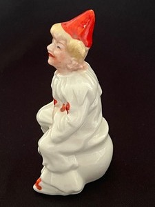 lot 40 image: Antique Porcelain Clown Figurine
