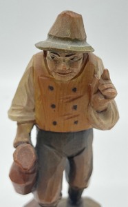 lot 312 image: Two Hand Carved Wooden Anri Figurines including Vintage Hand Carved Anri Traveling Man Figurine