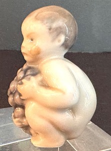 lot 307 image: Royal Copenhagen Baby Boy with Grapes #2325 Porcelain Figurine
