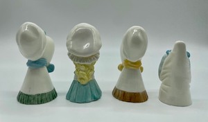 lot 109 image: Four Vintage Royal Worcester Candle Snuffers