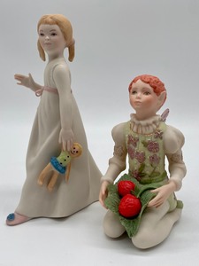 lot 114 image: Vintage Cybis Porcelain Peter Pans Wendy with her Ragdoll and Strawberry Boy Figurines