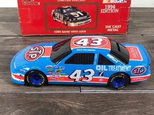 lot 67 image: 1994 Nascar Racing Champions Wally Dallenbach Pontiac Grand Prix #43  STP 124 scale die cast coin bank