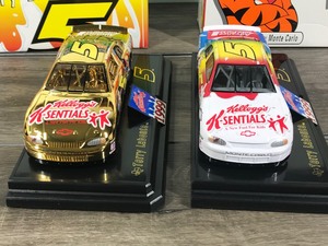 lot 82 image: 1999 Nascar Racing Champions 2 Car set Authentic 24K Gold & Regular Painted Car Terry Labonte Monte Carlo #5  Kellogs Sentials A New Fuel For Kids 124 scale die cast stock cars