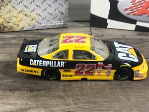 lot 100 image: 1999 Nascar Action Ward Burton Pontiac #22  Caterpillar 124 scale die cast stock car