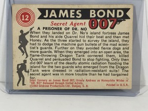 lot 417 image: 1965 Glidrose Productions James Bond Secret Agent 007 - A prisoner of Dr. No #12 Collectors Card