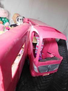 lot 210 image: Barbie camper with barbies, Beanie Babies, Musical doll and many more toys