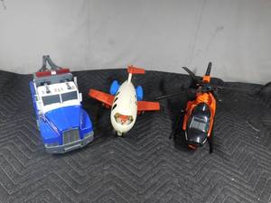 lot 211 image: Tonka Tow truck, Tonka helicopter and Fisher Price airplane