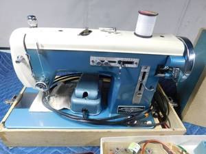 lot 239 image: Vintage Signature sewing machine with attatchments and extra belts in case