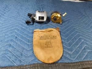 lot 334 image: 2 Vintage fishing reels with reel pouch