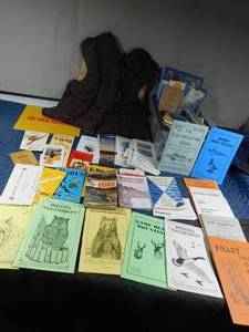 lot 335 image: Womens Stearns Medium life vest, taxidermy books, Ducks unlimited tickets, Books on shell tips, tote of maps and more
