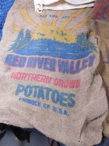 lot 514 image: 2  Advertized Potato gunny sacks and 1 canvas bag