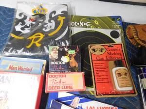 lot 517 image: Bow, Targets, gun holsters, ammo belt holder, hockey and twins flags, Camp Ripley post cards and more