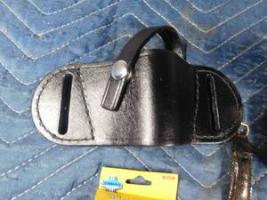 lot 518 image: 4 cases of new damaged screw removers, watch, lazer pointer, leather pistol holster, lighter