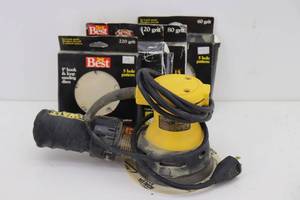 lot 29 image: DeWalt Palm Sander & Disks