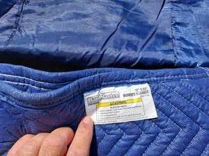 lot 97 image: Moving Blankets, Sleeping Bag, and Parka