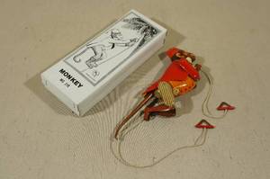 lot 221 image: Vintage Monkey Tin Toy