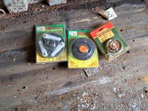 lot 1892 image: Lot of (3) Weed Whip Accessories - Weed Terminator II Trimmer Cutting Head, Grass Terminator Trimmer Cutting Head, Homelite E-Z-Line Advance System