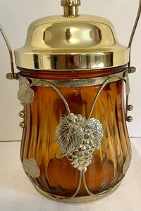 lot 145 image: Decorative Amber Colored Ornate Jar with Lid