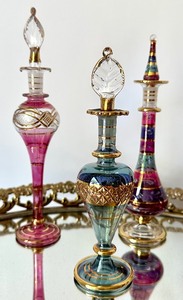 lot 68 image: Six Egyptian Art Glass Style Perfume Bottles and Oval Glass Top Vanity Tray