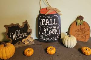 lot 82 image: Fall Decor- 1 hanging piece, 2 standing signs, 2 pumpkins, 3 pumpkin candles