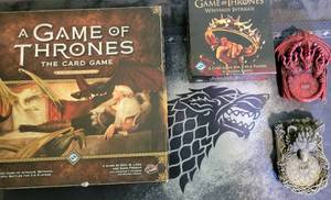 lot 109 image: Game of Thrones card games, mat, game house markers