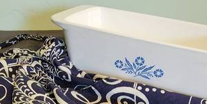 lot 128 image: Corning Ware Loaf pan and Vera Bradley Apron