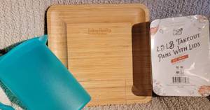 lot 182 image: wood charcuterie board with utensils, Tupperware Pitcher, and 2.5 lbs alluminum food prepstorage containers with lids 60 pack