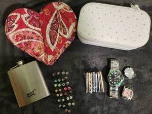 lot 184 image: 1 Travel zippered jewerly box, 1 Vera Bradley Jewerly box, 15 pairs of flat back earings (never worn), 7 tie clips, 1 mans watch (needs battery), 1 strawberry shortcake watch face (needs battery and band, 1 tinkerbelle watch face (needs battery and band),