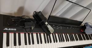 lot 3 image: Alesis Recital 88 Key Digital Piano Keyboard with Semi Weighted Keys, 2x20W Speakers, 5 Voices, Split, Layer and Lesson Mode, FX with Pro Series Adjustable X Style Piano Keyboard Heavy Duty Premium Stand and  Sustain Pedal and headphones